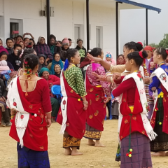 Nepalese dancers in front of a hospital, celebrating